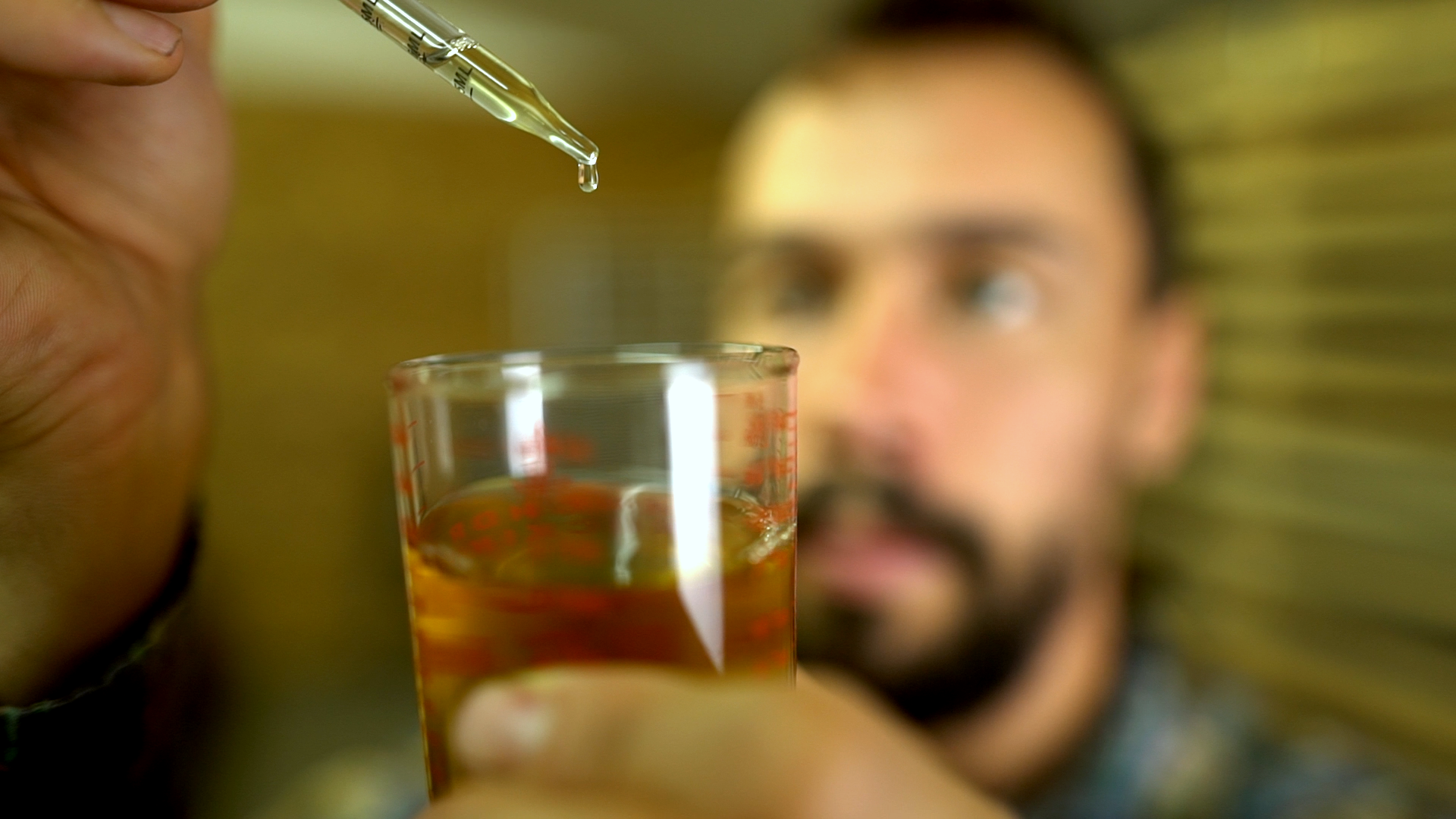 Man visually testing pine pollen tincture